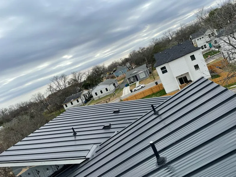 Standing seam metal roof panels with vents for Skylight Repair in Huntington